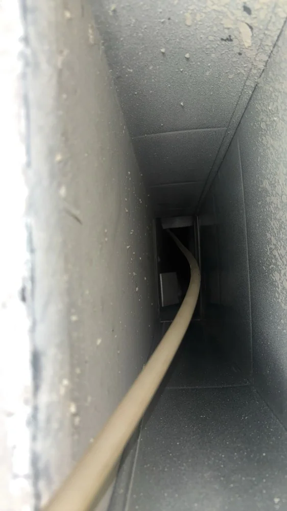 Interior of a metal duct before cleaning